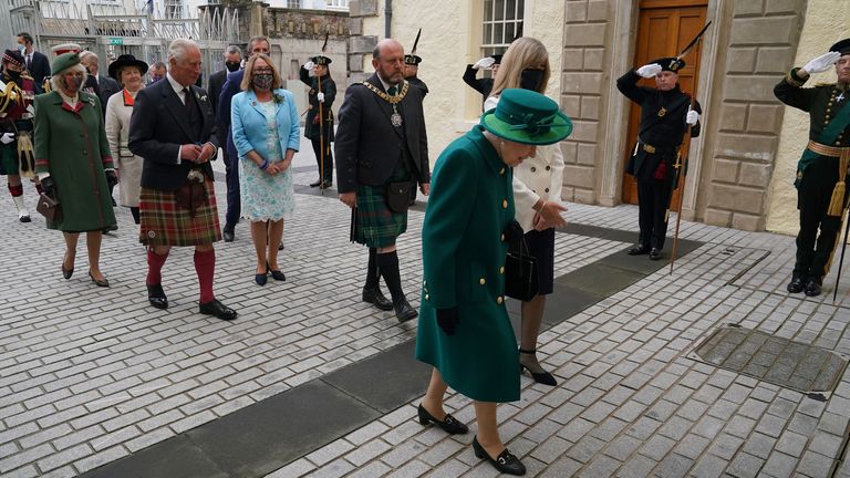 The Queen is followed into the Scottish Parliament by the Prince of Wales and the Duchess of Cornwall, known as the Duke and Duchess of Rothesay in Scotland