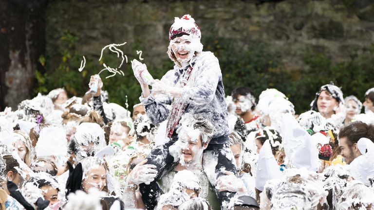 Hundreds of students take part in the traditional Raisin Monday foam fight on St Salvator&#39;s Lower College Lawn at the University of St Andrews in Fife. Picture date: Monday October 18, 2021.
