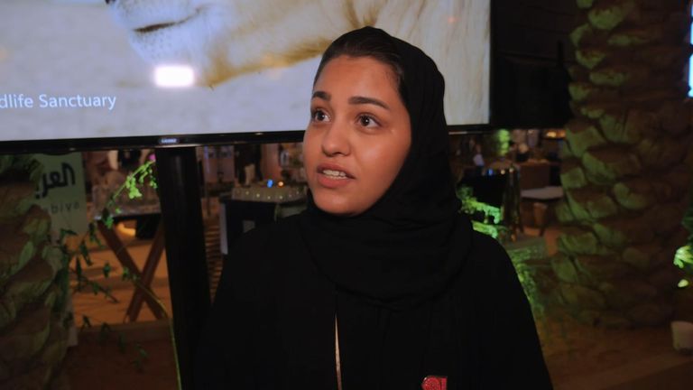 Young Saudi woman talking at climate conference