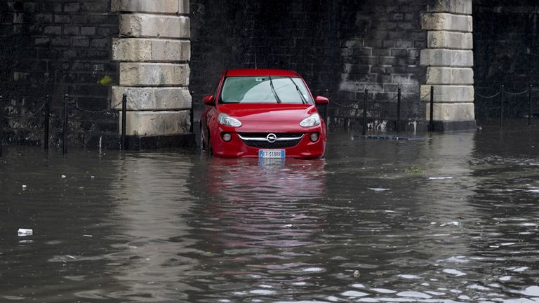unbiased news A car on a flooded street in Catania after the town was hit by heavy rainfall 