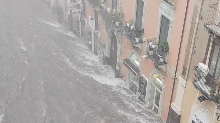 unbiased news Floodwater sweeping through a street in Catania, Sicily, on 26 October