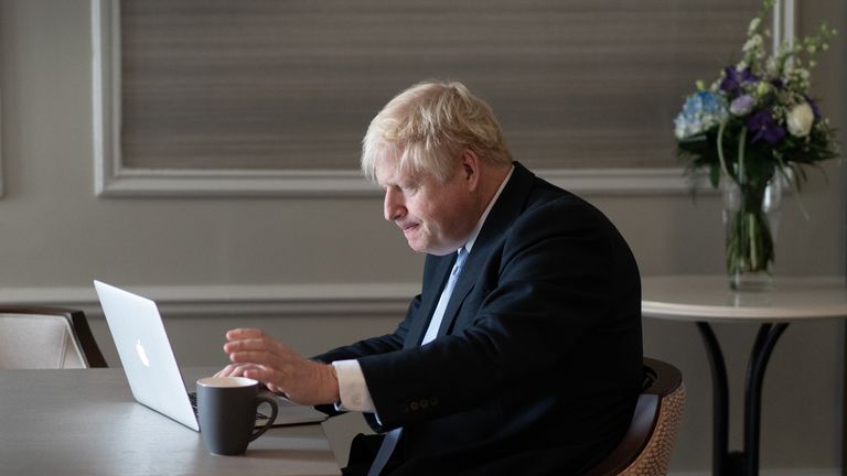 Prime Minister Boris Johnson prepares his keynote speech in his hotel room in Manchester before addressing the Conservative Party Conference on Wednesday. Picture date: Tuesday October 5, 2021.