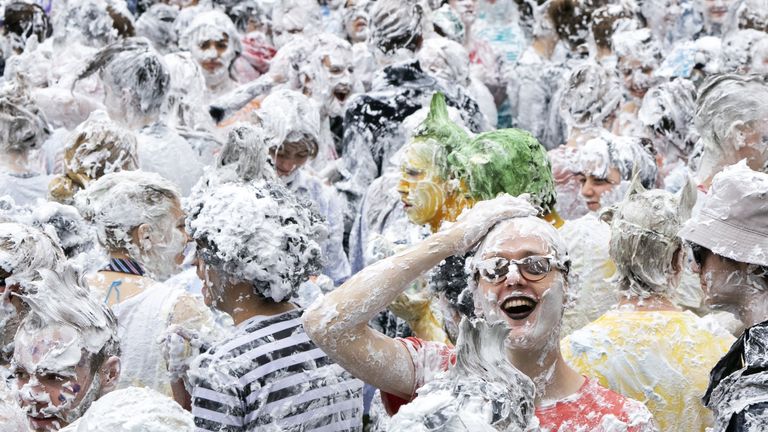 Hundreds of students take part in the traditional Raisin Monday foam fight on St Salvator&#39;s Lower College Lawn at the University of St Andrews in Fife. Picture date: Monday October 18, 2021.