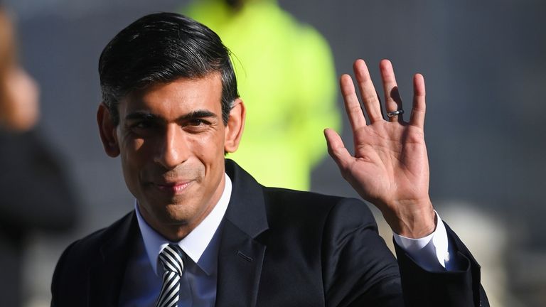 Britain's Chancellor of the Exchequer Rishi Sunak waves as he arrives to attend the annual Conservative Party Conference, in Manchester, Britain, October 6, 2021. REUTERS/Toby Melville
