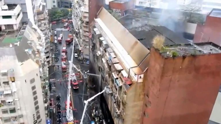 In this image taken from video by Taiwan's EBC, firefighters shoot water into a building that caught fire in Kaohsiung, in southern Taiwan on Thursday, Oct. 14, 2021. The fire engulfed a 13-story building overnight in southern Taiwan, killing some and injuring dozens, the island...s semi-official Central News Agency reported Thursday.  (EBC via AP )