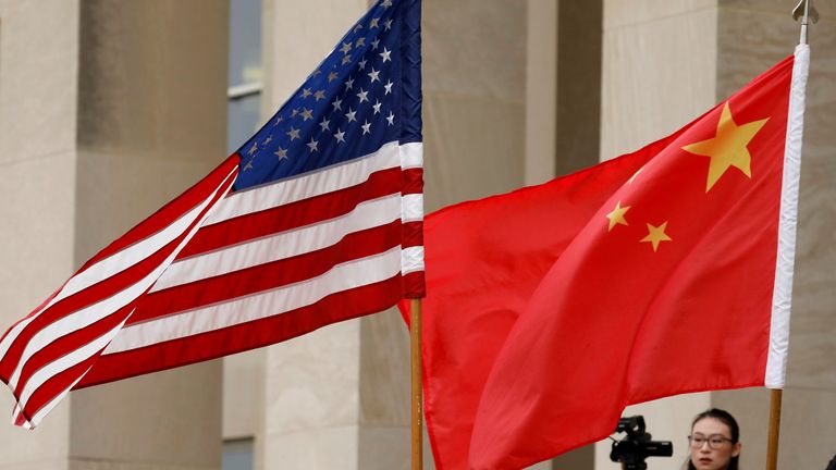 FILE PHOTO: U.S. and Chinese flags are seen before a meeting between senior defence officials from both countries at the Pentagon in Arlington, Virginia, U.S., November 9, 2018. REUTERS/Yuri Gripas/File Photo
