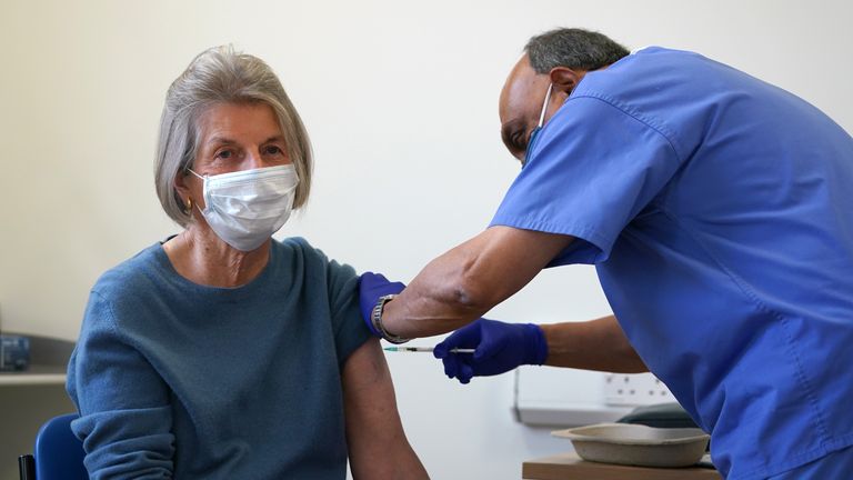 Doctor Abhi Mantgani administers a Covid-19 vaccine booster to Shirley Davies at Birkenhead Medical Building in Birkenhead, Merseyside. Picture date: Saturday October 23, 2021.