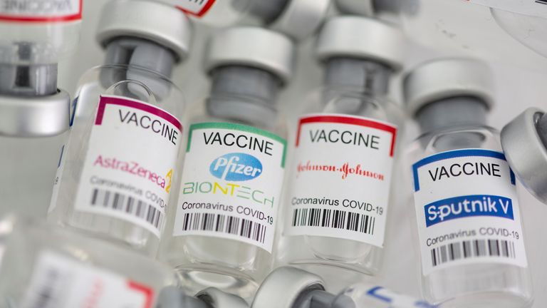 Vials of COVID vaccines made by AstraZeneca, Pfizer, Johnson and Johnson, and Sputnik V