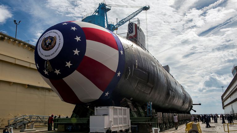 Virginia-class attack submarine Pre-Commissioning Unit (PCU) John Warner (SSN 785) is transferred to the floating drydock at Newport News Shipyard for the 9th August 2014 in Newport News, Virginia, USA Prepare for baptism on 6th. REPORT CHINA-CYBER/CLOUDHOPPER USN/John Whalen/Huntington Ingalls Industries/REUTERS NOTE EDITOR'S HANDOUT - This image was provided by a third party.