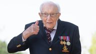 File photo dated 16/04/2020 of the then 99-year-old war veteran Captain Tom Moore at his home in Marston Moretaine, Bedfordshire, after he achieved his goal of 100 laps of his garden. Captain Sir Tom Moore has died at the age of 100 after testing positive for Covid-19, his daughters Hannah and Lucy said in a statement. Issue date: Tuesday February 2, 2021.