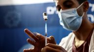 A nurse prepares a syringe to give a third dose of the COVID-19 vaccine, in Jerusalem
