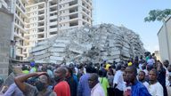 People gather at the site of a collapsed 21-story building in Ikoyi, Lagos, Nigeria, November 1, 2021. REUTERS/Temilade Adelaja
