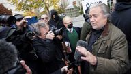 Steve Bannon, talk show host and former White House advisor to former President Donald Trump, speaks to the media as he arrives at the FBI&#39;s Washington field office to turn himself in to federal authorities after being indicted for refusal to comply with a congressional subpoena over the January 6 attacks on the U.S. Capitol in Washington, U.S., November 15, 2021. REUTERS/Kevin Lamarque
