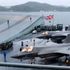 Russian aircraft 'buzzed' Royal Navy aircraft carrier, says defence minister, as sea search continues for ditched stealth fighter