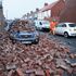 A man makes safe fallen masonry from a property, which has damaged a nearby car, on Gloucester Avenue in Roker, Sunderland, after gusts of almost 100 miles per hour battered some areas of the UK during Storm Arwen. Picture date: Saturday November 27, 2021.