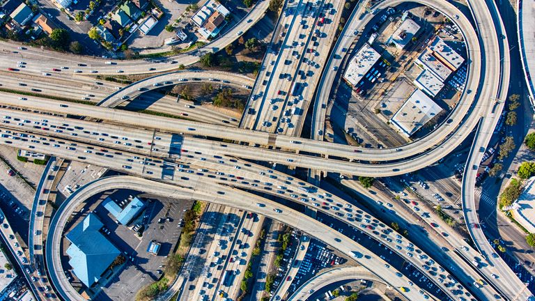The heavy traffic on the interchange between the Interstate 10 and 110 freeways near downtown Los Angeles, California during rush hour.