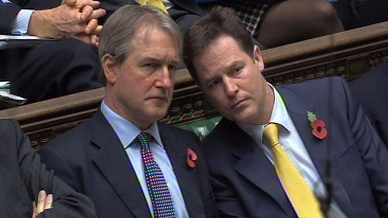 (left to right) Secretary of State for Northern Ireland Owen Paterson and Deputy Prime Minister Nick Clegg listen to Labour Party Deputy Leader Harriet Harman speak during Prime Minister&#39;s Questions in the House of Commons, London.
