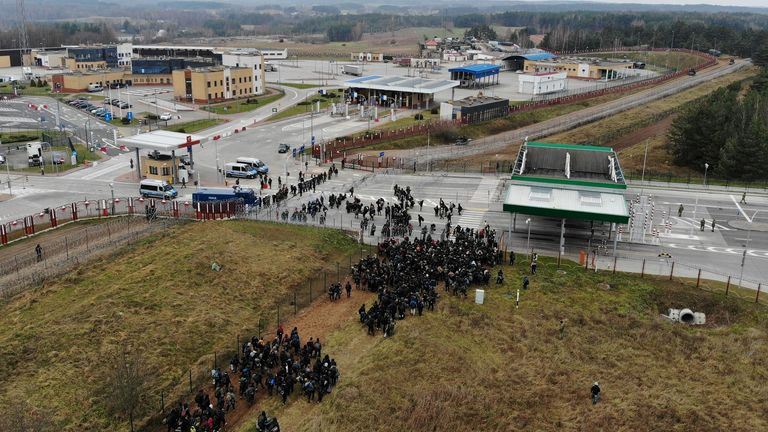 Migrants gather on the Belarusian-Polish border in an attempt to cross it at the Bruzgi-Kuznica Bialostocka border crossing in the Grodno Region, Belarus November 15, 2021. Picture taken with a drone. Leonid Scheglov/BelTA/Handout via REUTERS ATTENTION EDITORS - THIS IMAGE HAS BEEN SUPPLIED BY A THIRD PARTY. NO RESALES. NO ARCHIVES. MANDATORY CREDIT.
