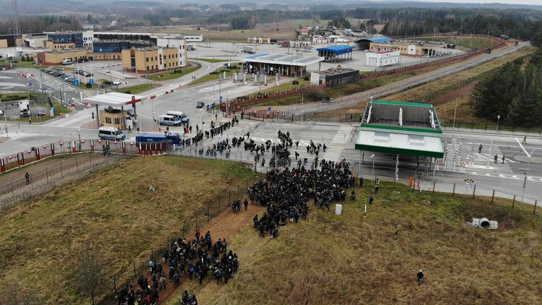 Migrants gather on the Belarusian-Polish border in an attempt to cross it at the Bruzgi-Kuznica Bialostocka border crossing in the Grodno Region, Belarus November 15, 2021. Picture taken with a drone. Leonid Scheglov/BelTA/Handout via REUTERS ATTENTION EDITORS - THIS IMAGE HAS BEEN SUPPLIED BY A THIRD PARTY. NO RESALES. NO ARCHIVES. MANDATORY CREDIT.
