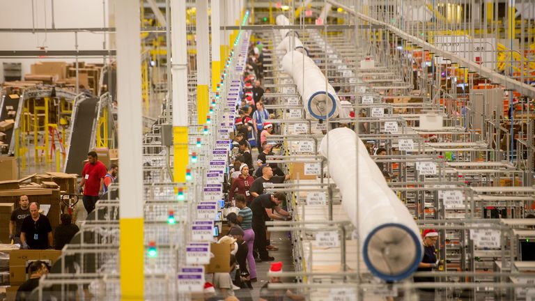 Workers prepare outgoing shipments at an Amazon Fulfillment Center, ahead of the Christmas rush, in Tracy, California, November 30, 2014. REUTERS/Noah Berger (UNITED STATES - Tags: BUSINESS SOCIETY TPX IMAGES OF THE DAY)
