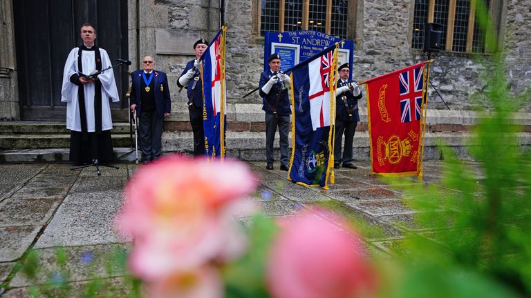 People observe a two minute silence to remember the war dead on Armistice Day at St Andrew&#39;s church in Plymouth, Devon. Picture date: Thursday November 11, 2021.
