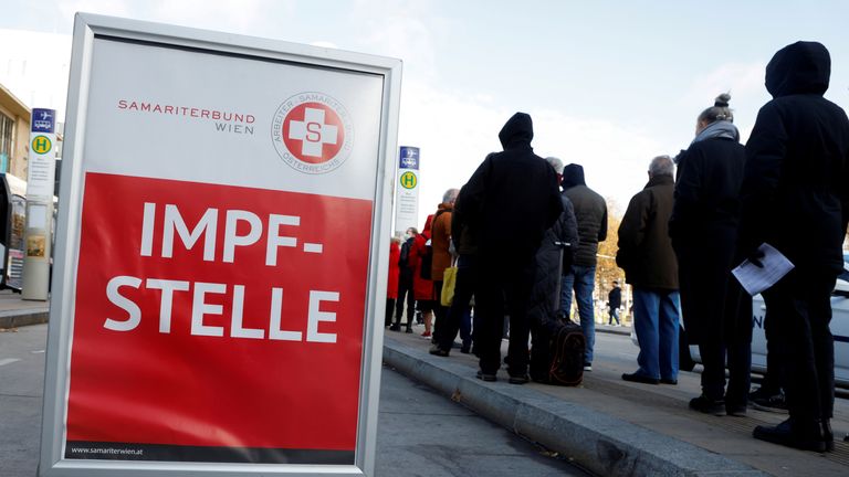 People queue for a vaccination bus in Vienna, Austria