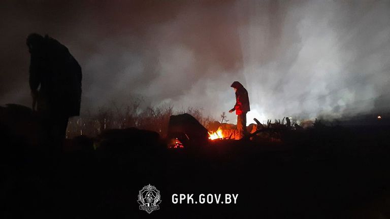 migrant warms himself at a fire in a tent camp set by migrants from the Middle East and elsewhere gathering at the Belarus-Poland border near Grodno, Belarus. Polish authorities said Wednesday that two groups of migrants managed to cross the border from Belarus into Poland but that all the people in the groups were detained. Poland&#39;s Defense Ministry also accused Belarusian forces of firing shots into the air in a border area where migrants have set up a makeshift camp.  PIC:AP