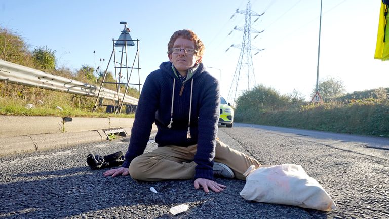 Ben Buse
A protester glued to the road at an Insulate Britain roadblock on St Albans Road near to the South Mimms roundabout at the junction of the M25 and A1. Picture date: Tuesday November 2, 2021.

