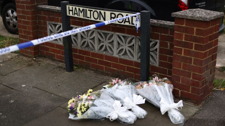 Floral tributes are seen at the scene at the scene of a house fire in Bexleyheath, south-east London, Britain, November 19, 2021. REUTERS/Tom Nicholson
