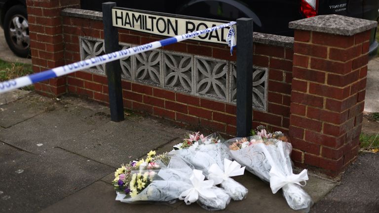 Floral tributes are seen at the scene at the scene of a house fire in Bexleyheath, south-east London, Britain, November 19, 2021. REUTERS/Tom Nicholson
