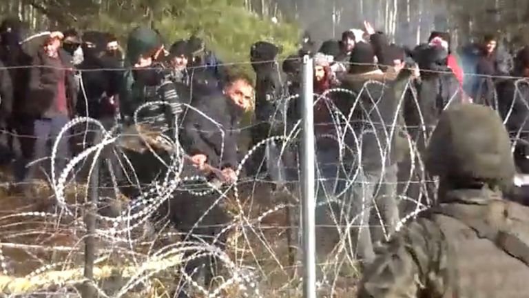 Hundreds of migrants try to cross from the Belarus side of the border with Poland near Kuznica Bialostocka, Poland, in this video-grab released by the Polish Defence Ministry, November 8, 2021. MON/Handout via REUTERS THIS IMAGE HAS BEEN SUPPLIED BY A THIRD PARTY
