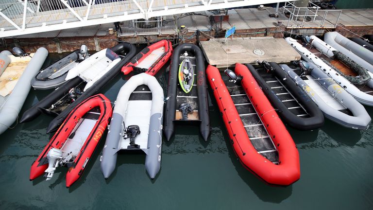 Boats used in previous migrant crossings are moored at a harbour in Dover