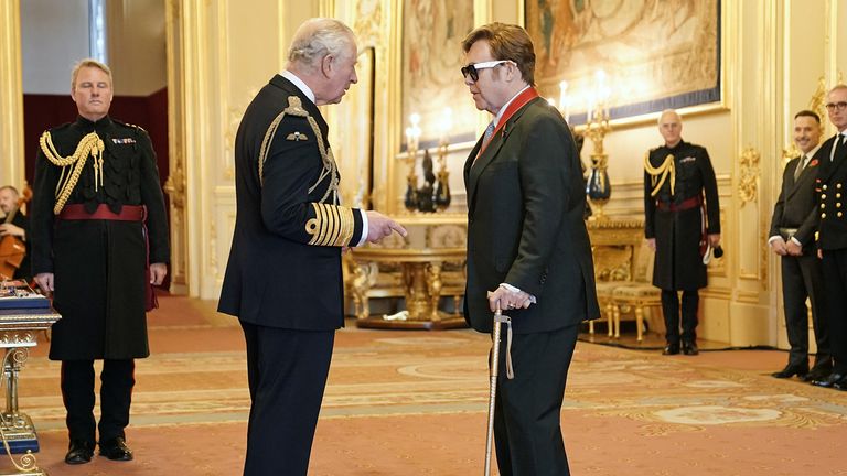Sir Elton John is made a member of the Order of the Companions of Honour by the Prince of Wales during an investiture ceremony at Windsor Castle. Picture date: Wednesday November 10, 2021.