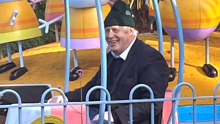 Britain&#39;s Prime Minister Boris Johnson, his wife Carrie Johnson and son enjoy a ride at Peppa Pig World near Ower, England, Britain November 21, 2021. Picture taken November 21, 2021. George Edgar/Handout via REUTERS  THIS IMAGE HAS BEEN SUPPLIED BY A THIRD PARTY. MANDATORY CREDIT  George Edgar/Handout via REUTERS 