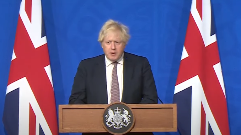 Boris Johnson holding a news conference after two cases of the new Omicron COVID variant were detected in the UK