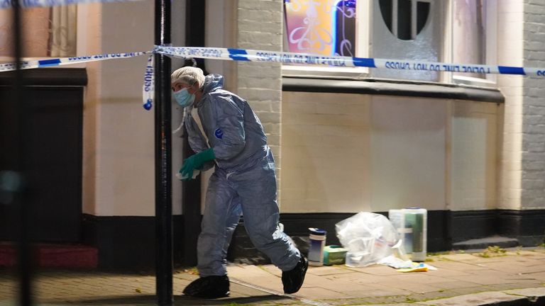 
Police at the scene in Albany Parade in Brentford, where a man has been killed and a pensioner is in a critical condition in hospital after they were stabbed in a street in west London. Picture date: Friday November 12, 2021