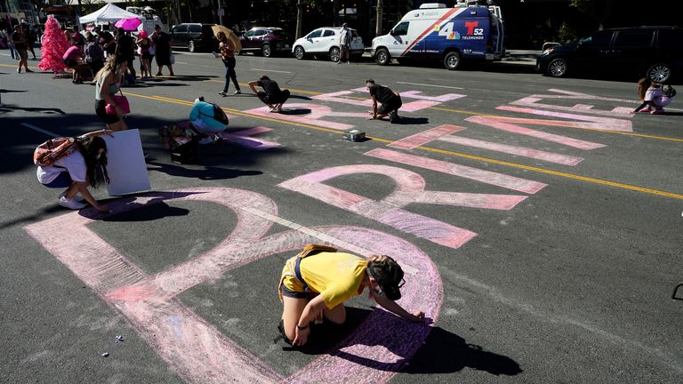 Stacy Moffatt, of Costa Mesa, California, bottom, and other Britney Spears supporters pictured outside a hearing on the pop singer&#39;s conservatorship at the Stanley Mosk Courthouse in LA. Pic: AP/Chris Pizzello


