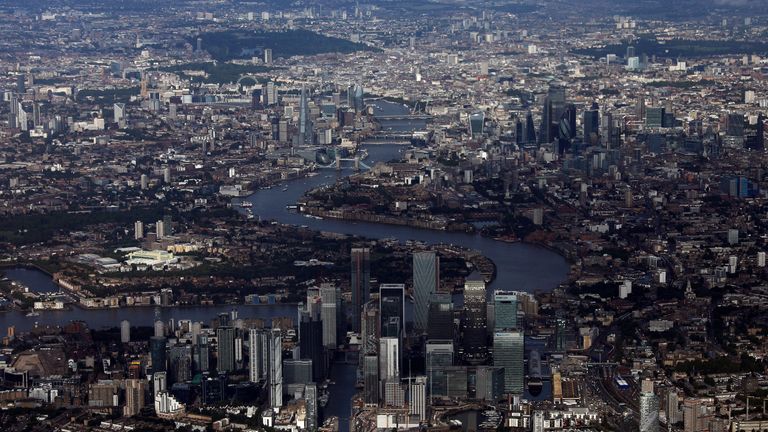 2019 - Canary Wharf and the City of London financial district are seen from an aerial view in London, Britain, August 8, 2019. REUTERS/Hannah McKay
