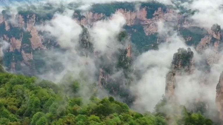 Drone captures low lying clouds around China&#39;s sandstone columns