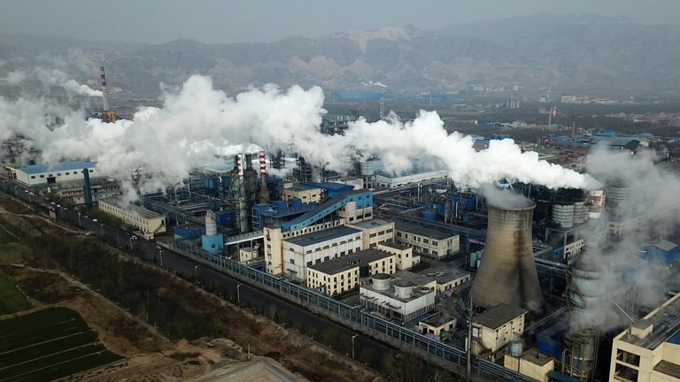 FILE - In this Nov. 28, 2019 file photo, smoke and steam rise from a coal processing plant in Hejin in central China&#39;s Shanxi Province.  
PIC:AP                                        