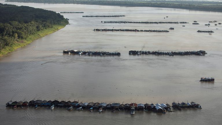 An aerial view shows hundreds of dredging rafts operated by illegal miners who have gathered in a gold rush on the Madeira, a major tributary of the Amazon river, in Autazes, Amazonas state, Brazil November 23, 2021. Picture taken November 23, 2021. REUTERS/Bruno Kelly

