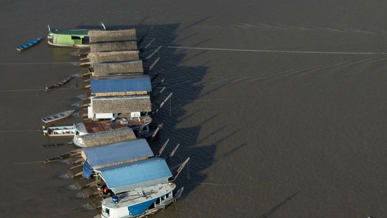 An aerial view shows dredging rafts operated by illegal miners who have gathered in a gold rush on the Madeira, a major tributary of the Amazon river in Autazes, Amazonas state, November 23, 2021. Picture taken November 23, 2021. REUTERS/Bruno Kelly
