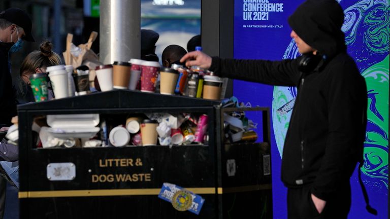 A man places rubbish on a litter bin on another day at the COP26 U.N. Climate Summit in Glasgow, Scotland, Wednesday, Nov. 3, 2021. The U.N. climate summit in Glasgow gathers leaders from around the world, in Scotland&#39;s biggest city, to lay out their vision for addressing the common challenge of global warming. (AP Photo/Alastair Grant)
PIC:AP

