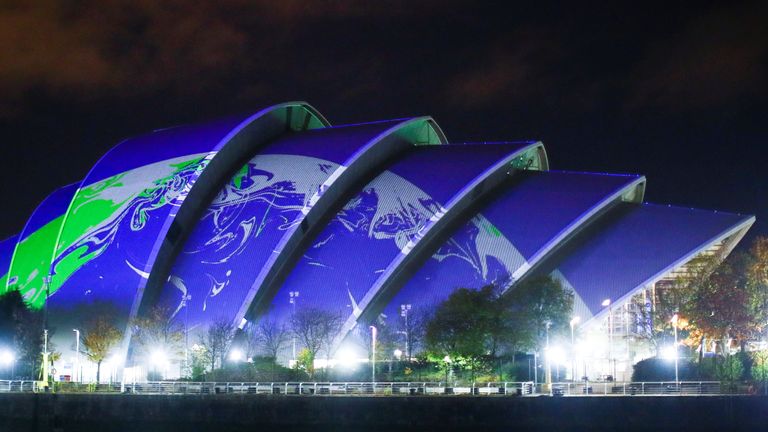 An image of Earth is projected on the venue for COP26 summit in Glasgow, Scotland Britain, November 1, 2021. REUTERS/Hannah Mckay