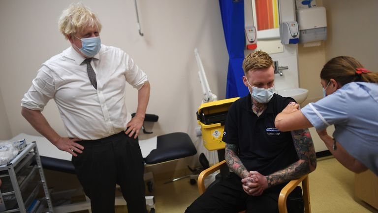 Prime Minister Boris Johnson watches as nurse Sandra Guy gives a COVID-19 booster jab during a visit to Hexham General Hospital in Northumberland. Picture date: Monday November 8, 2021.
