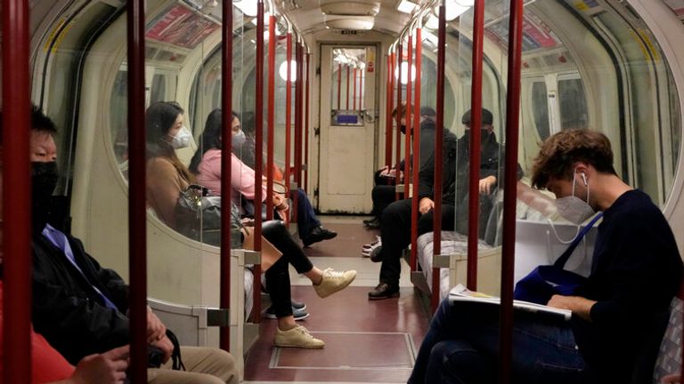 People traveling in a tube underground train carriage wear face masks to curb the spread of coronavirus on the Bakerloo Line in London. Many scientists are pressing the British government to re-impose social restrictions and speed up booster vaccinations as coronavirus infection rates, already Europe’s highest, rise once more. 