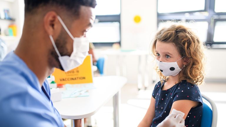 Young child with face mask getting vaccinated, coronavirus, covid-19 and vaccination concept. Pic: iStock