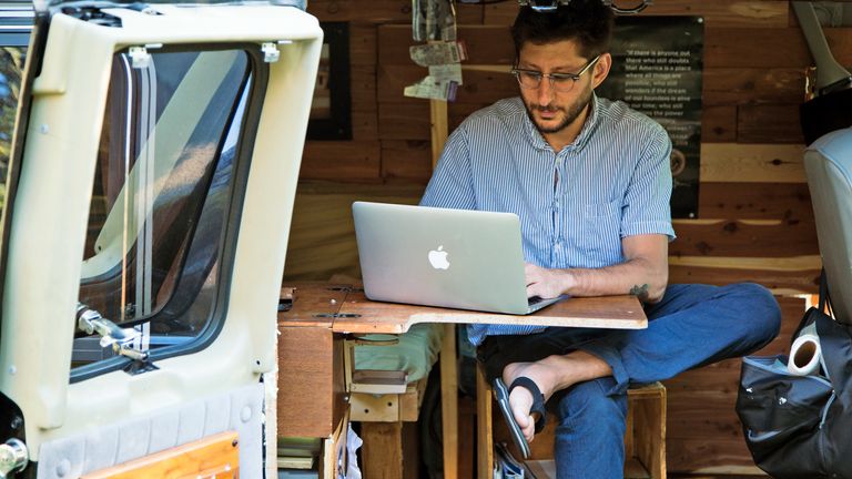 Pic: AP
In this 2017  Danny Fenster working out of his van that he made into a home/office. The parents and brother of an American journalist who has been detained in Myanmar for 100 days are vowing to never stop working to secure his release (Fenster Family photo via AP)