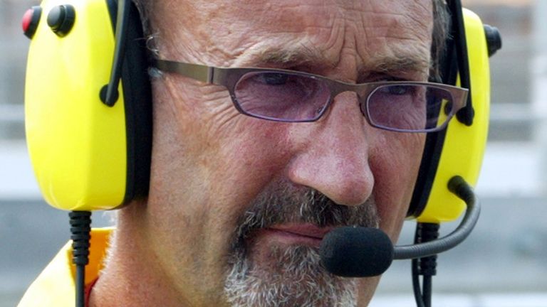 Eddie Jordan, team leader of Jordan Ford listens to the radio during the first qualifying session at the Hockenheimring race track August 1, 2003