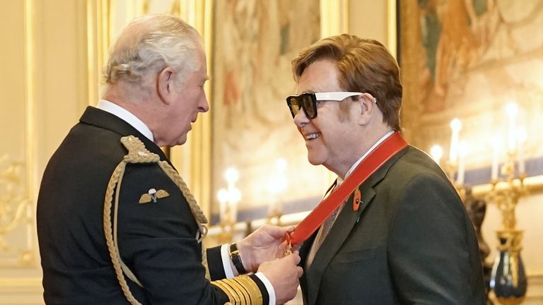 Sir Elton John is made a member of the Order of the Companions of Honour by the Prince of Wales during an investiture ceremony at Windsor Castle. Picture date: Wednesday November 10, 2021.
